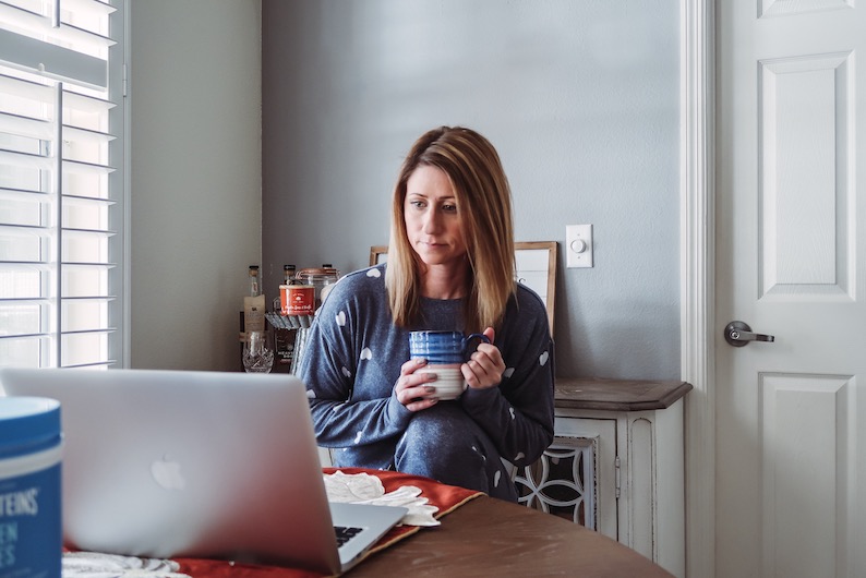 Girl sitting with coffee mug and Vital Proteins